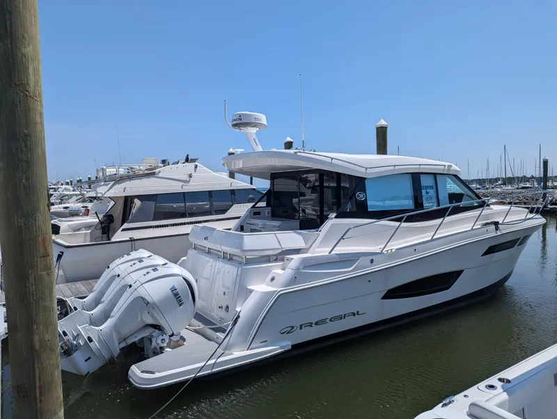 Slide: The Image of 2024 Regal 38XO luxury yacht docked at marina. - 3