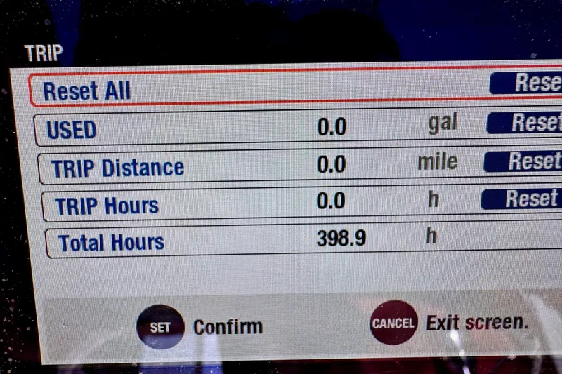 Slide: The Image of Display screen of 2023 BlackJack 256 Bay showing trip data and total hours. - 10