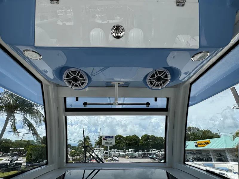 Slide: The Image of 2025 Robalo R360 Center Console interior with speakers and panoramic view. - 17