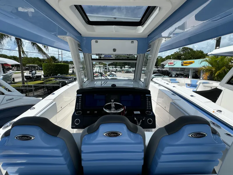Slide: The Image of 2025 Robalo R360 Center Console boat interior with modern helm and seating. - 16