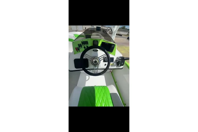 Slide: The Image of 2026 Aloha Pontoon 300 dashboard with green accents and modern controls. - 5
