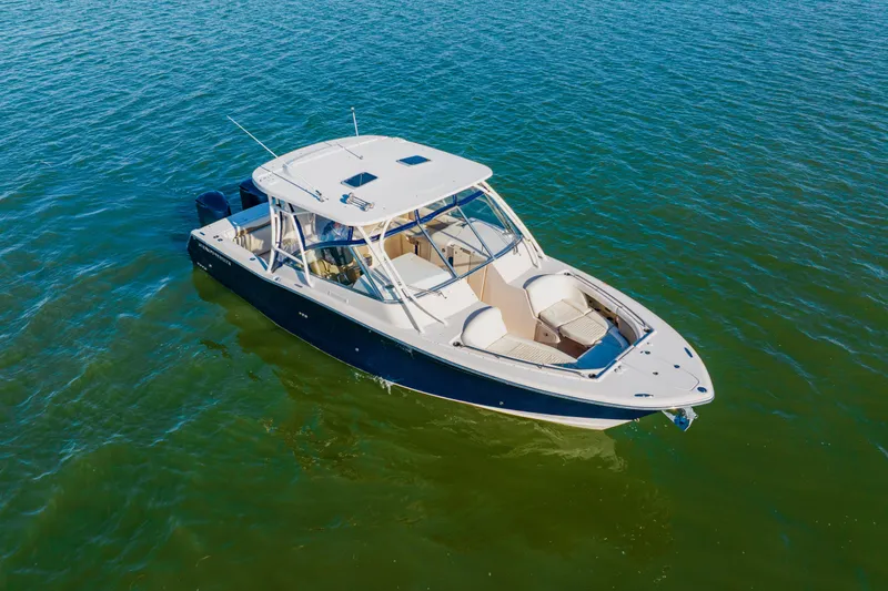 Slide: The Image of 2013 Grady-White Freedom 335 boat on calm water, aerial view. - 10