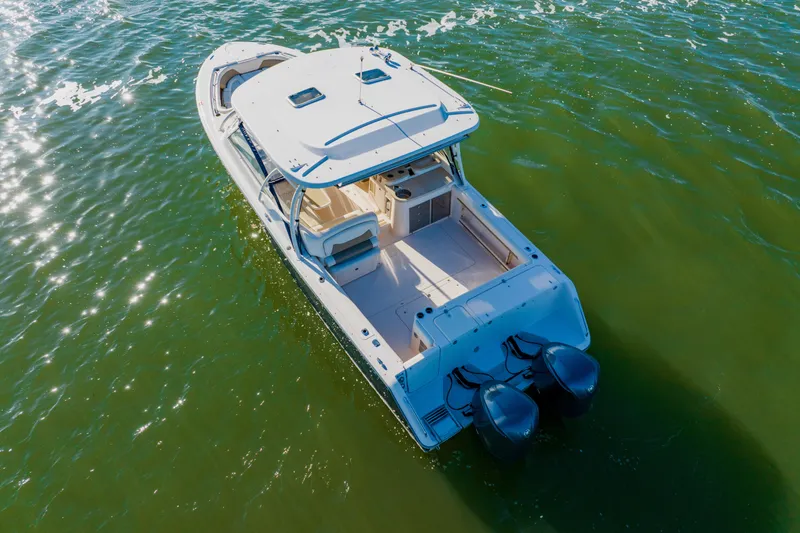 Slide: The Image of 2013 Grady-White Freedom 335 boat on shimmering water, aerial view. - 13