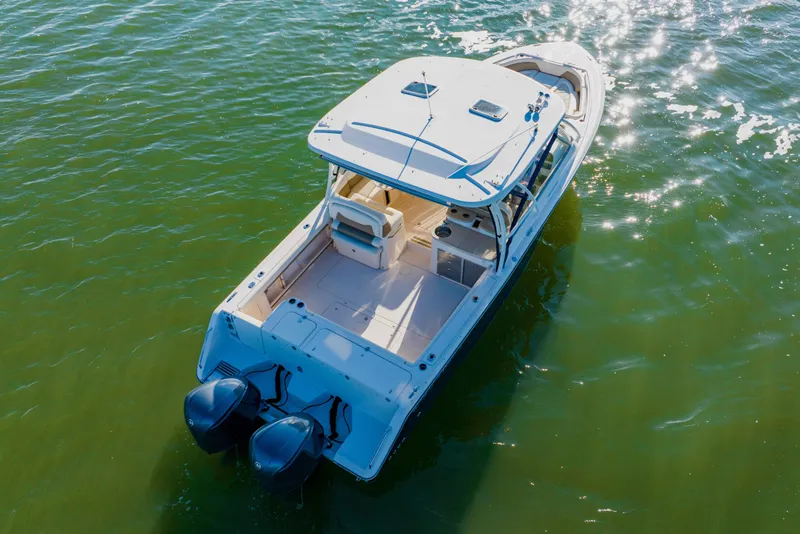 Slide: The Image of 2013 Grady-White Freedom 335 boat on sparkling water, aerial view. - 14