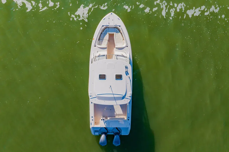 Slide: The Image of Overhead view of 2013 Grady-White Freedom 335 boat on green water. - 15
