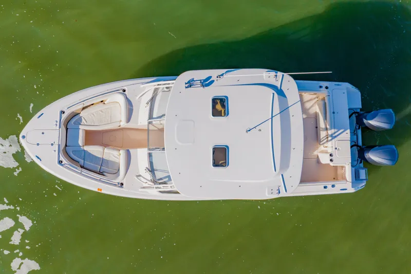 Slide: The Image of Aerial view of 2013 Grady-White Freedom 335 boat on green water. - 16