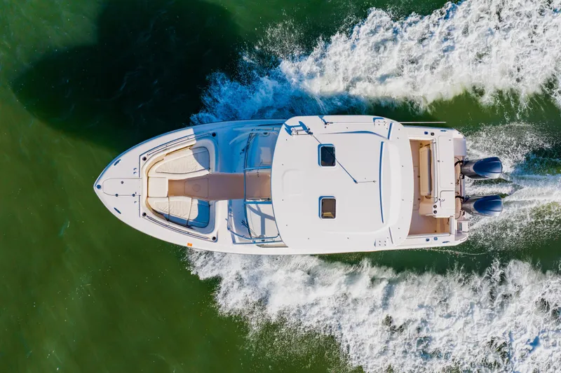 Slide: The Image of Aerial view of 2013 Grady-White Freedom 335 boat cruising on water. - 27