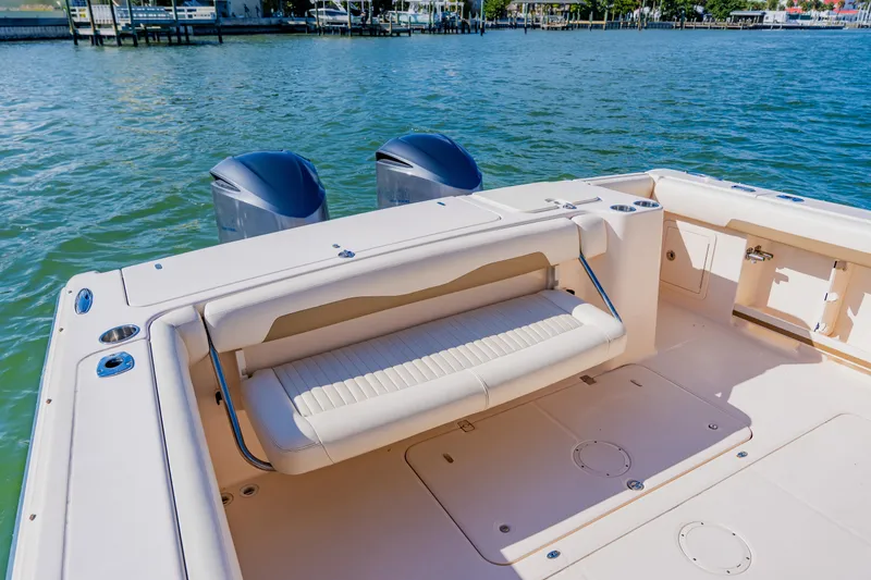 Slide: The Image of 2013 Grady-White Freedom 335 boat with seating, dual engines, and scenic water view. - 32