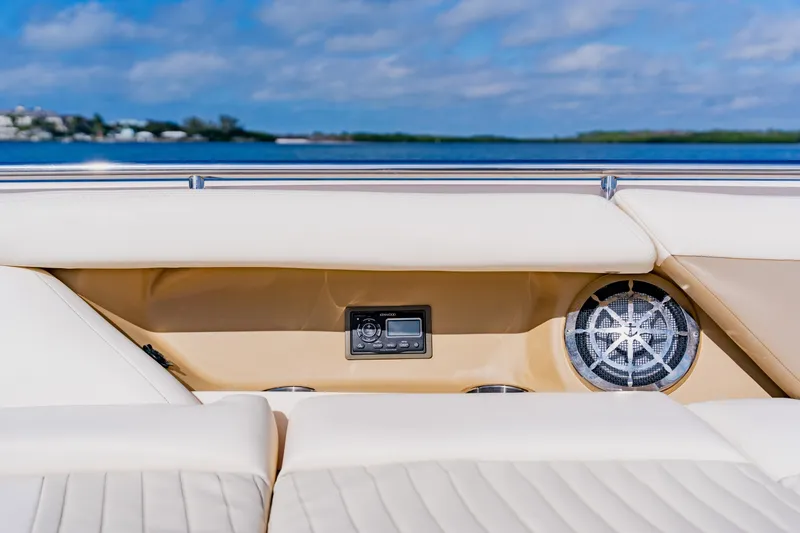 Slide: The Image of 2013 Grady-White Freedom 335 boat interior with speaker and control panel, ocean view. - 49