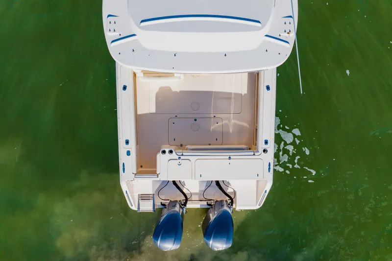 Slide: The Image of Overhead view of 2013 Grady-White Freedom 335 boat on green water. - 5