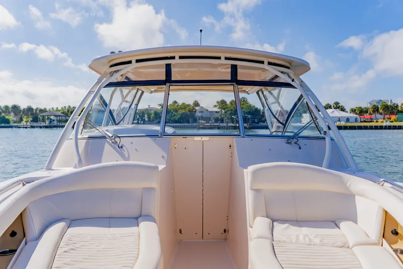 Slide: The Image of 2013 Grady-White Freedom 335 boat interior with seating, on a sunny day. - 50