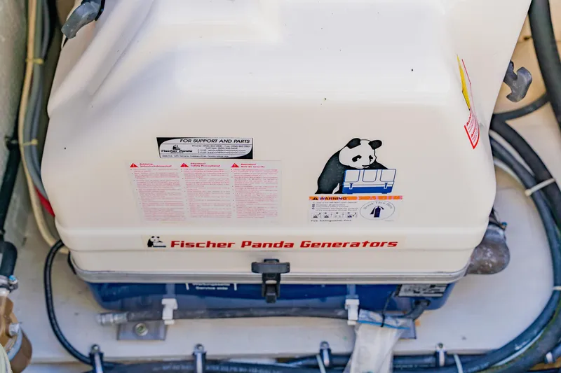 Slide: The Image of Fischer Panda generator in 2013 Grady-White Freedom 335 boat engine compartment. - 59