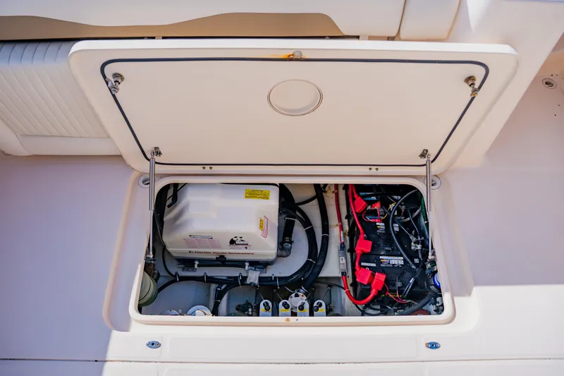Slide: The Image of 2013 Grady-White Freedom 335 boat engine compartment with wiring and components. - 60
