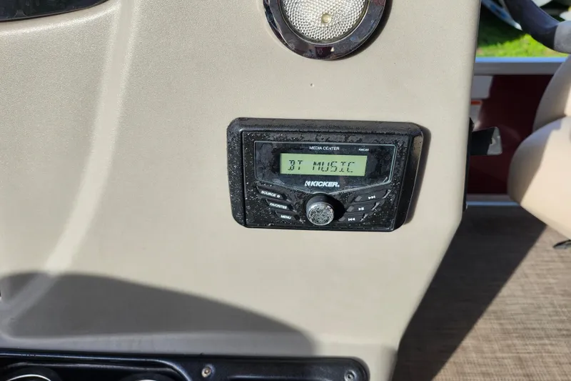 Slide: The Image of 2023 Sun Tracker Bass Buggy 18 DLX boat dashboard with Kicker media center. - 15