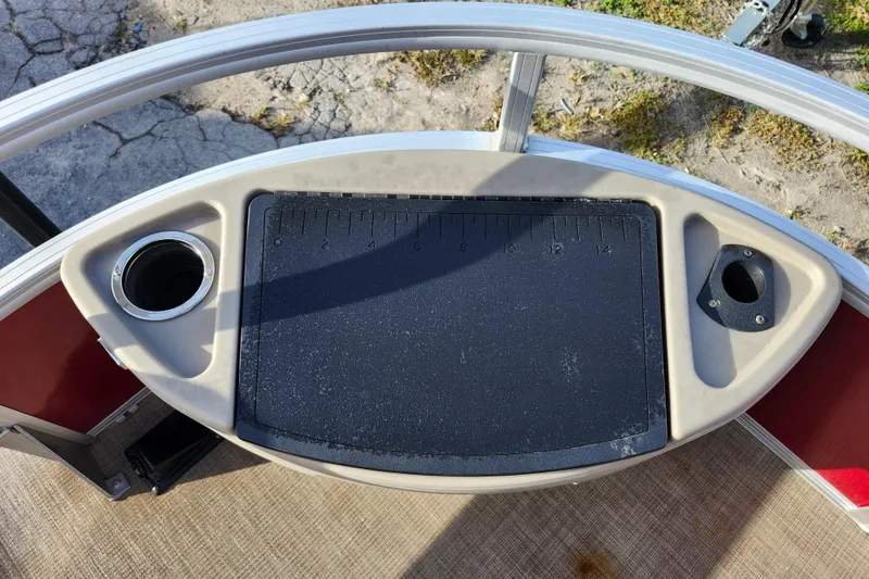 Slide: The Image of 2023 Sun Tracker Bass Buggy 18 DLX fishing station with cup holders and measuring board. - 25