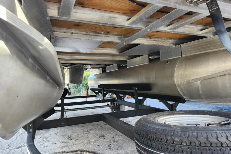 Slide: The Image of Underneath view of 2023 Sun Tracker Bass Buggy 18 DLX pontoon boat on trailer. - 38