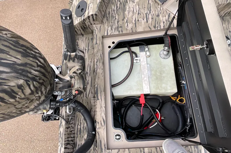 Slide: The Image of 2026 Excel Tomahawk 183 boat interior showing storage compartment and wiring details. - 7