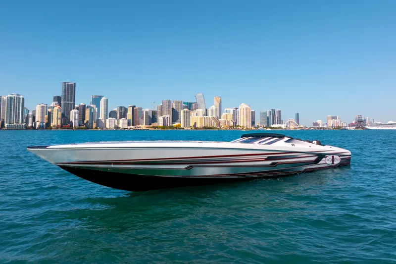 The Image of 2020 Cigarette 515 powerboat on water with city skyline backdrop. - 0