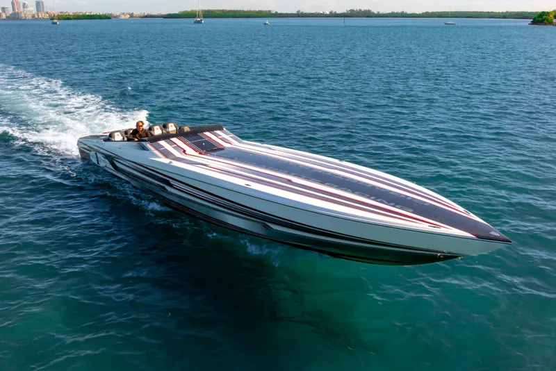 Slide: The Image of 2020 Cigarette 515 speedboat cruising on open water, showcasing sleek design and performance. - 11