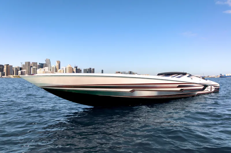 Slide: The Image of 2020 Cigarette 515 speedboat on water with city skyline in background. - 12