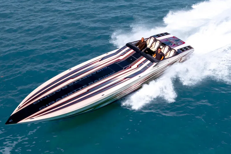 Slide: The Image of 2020 Cigarette 515 speedboat cruising on open water, showcasing sleek design and performance. - 13