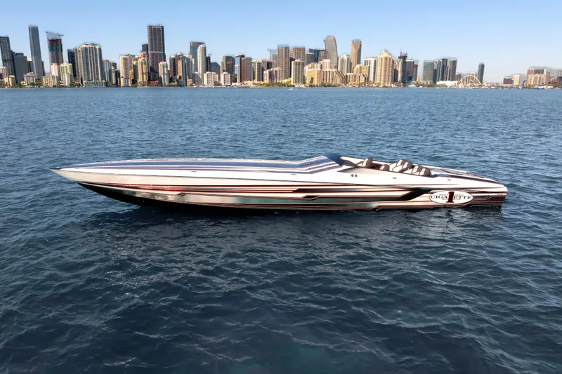 Slide: The Image of 2020 Cigarette 515 speedboat on water with city skyline in background. - 14