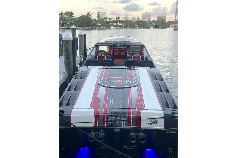 Slide: The Image of Interior of 2020 Cigarette 515 boat, featuring sleek white and black seating design. - 4