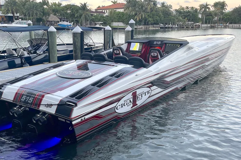 Slide: The Image of 2020 Cigarette 515 boat interior with four luxury seats, docked at marina. - 5