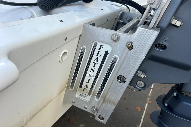 Slide: The Image of 2006 Triton 22 Bay Flight boat with Flats Jac jack plate detail. - 11