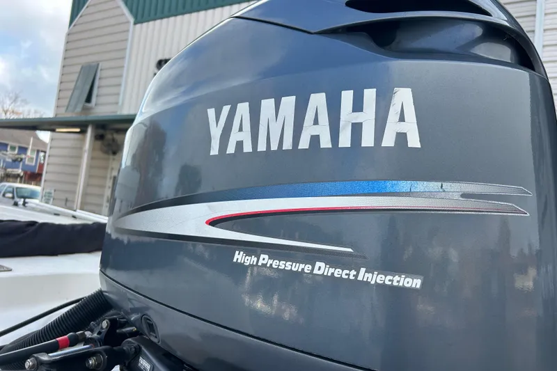 Slide: The Image of Yamaha outboard motor on 2006 Triton 22 Bay Flight boat, high pressure direct injection. - 12