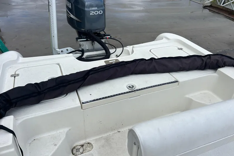 Slide: The Image of 2006 Triton 22 Bay Flight boat with Yamaha 200 outboard motor, docked. - 13