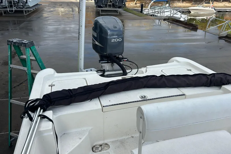 Slide: The Image of 2006 Triton 22 Bay Flight boat with Yamaha 200 engine at dock. - 24