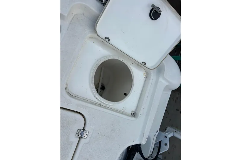 Slide: The Image of Open storage compartment on a 2006 Triton 22 Bay Flight boat. - 26