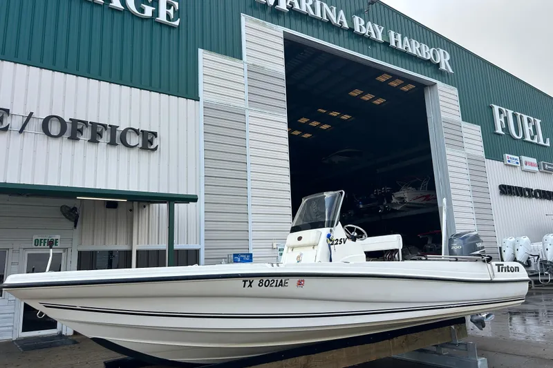 Slide: The Image of 2006 Triton 22 Bay Flight boat at Marina Bay Harbor storage facility. - 9