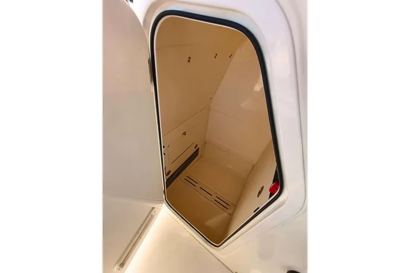 Slide: The Image of 2024 Scout 215 XSF boat storage compartment interior view. - 15