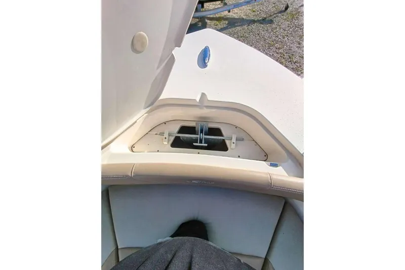 Slide: The Image of 2024 Scout 215 XSF boat interior with open storage compartment. - 20