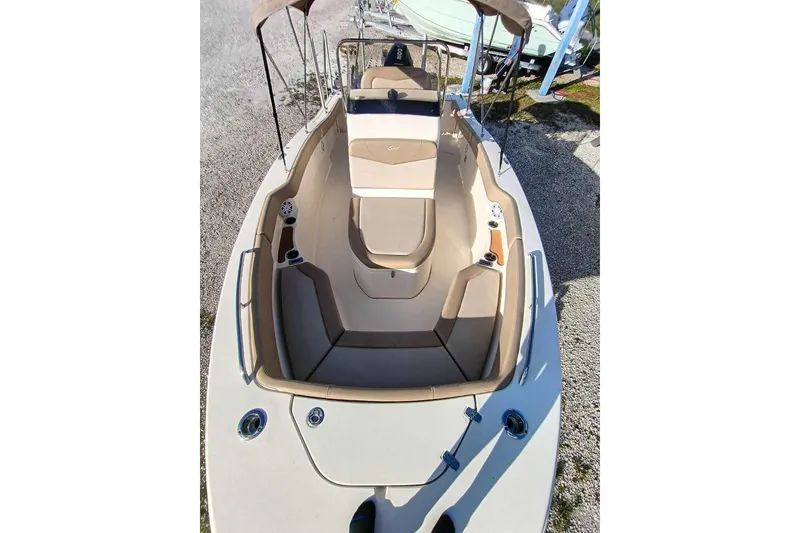 Slide: The Image of 2024 Scout 215 XSF boat interior with beige seating and modern design. - 23