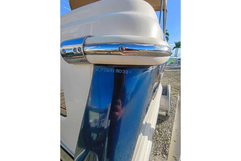 Slide: The Image of 2024 Scout 215 XSF boat detail with chrome finish and hull identification number. - 35