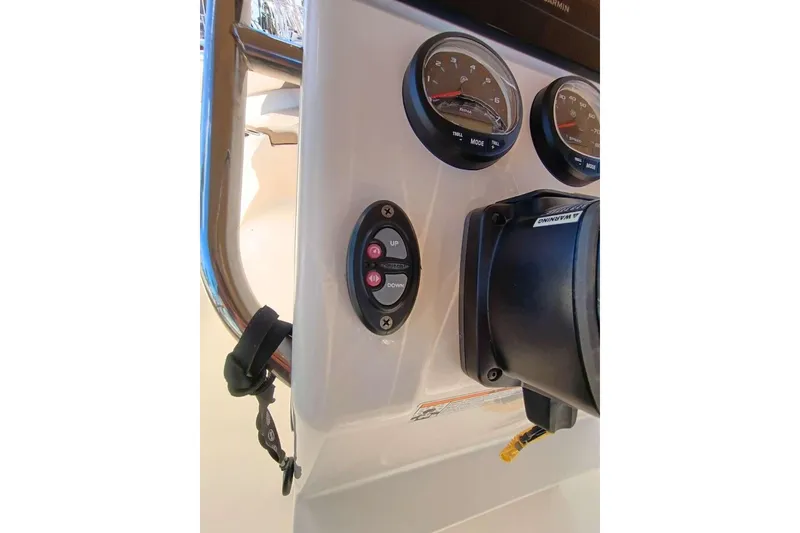 Slide: The Image of 2024 Scout 215 XSF boat dashboard with gauges and controls. - 8