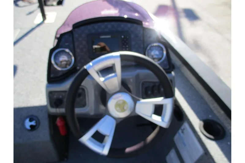 Slide: The Image of 2022 G3 Sportsman 1710 boat dashboard with steering wheel and gauges. - 11