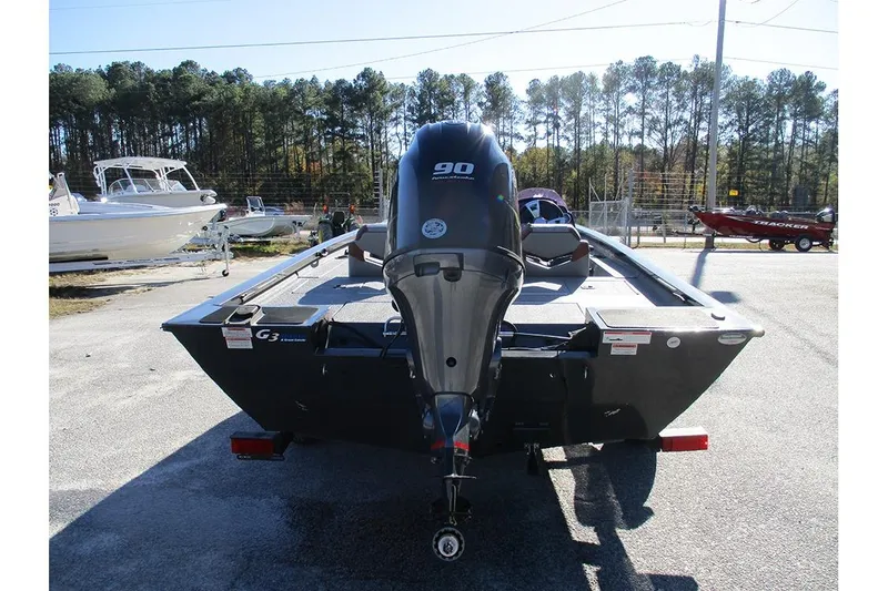 Slide: The Image of 2022 G3 Sportsman 1710 boat with 90 HP outboard motor, parked outdoors. - 4