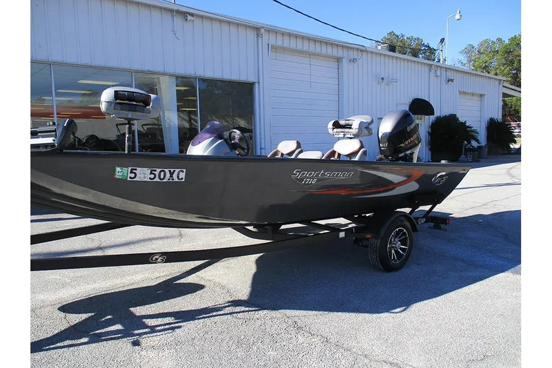 Slide: The Image of 2022 G3 Sportsman 1710 boat on trailer, parked outside a building. - 7