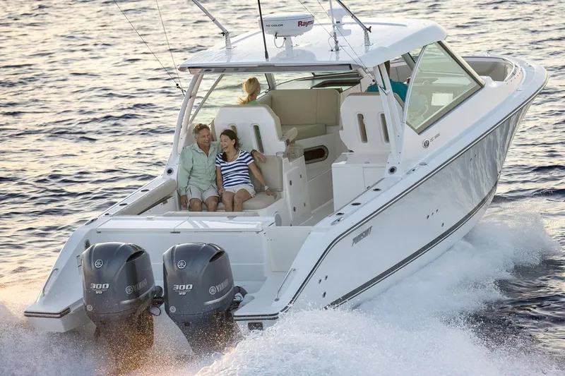 Slide: The Image of Manufacturer Provided Image: 2018 Pursuit DC 325 Dual Console boat cruising with passengers on open water. - 17