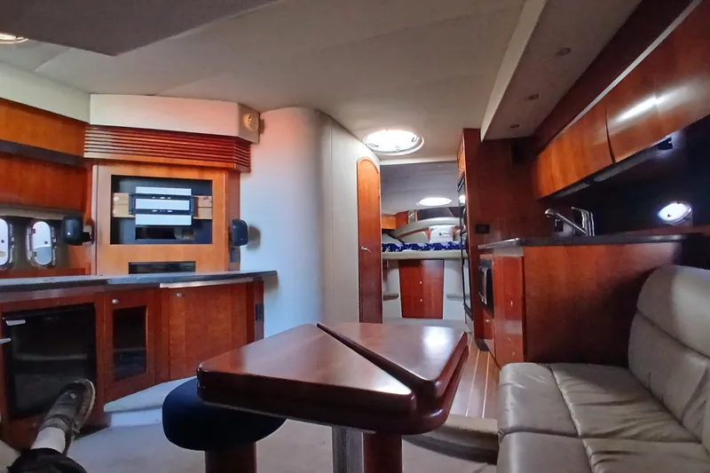 Slide: The Image of Luxurious interior of 2007 Cruisers Yachts 420 Express with elegant wood finishes. - 5
