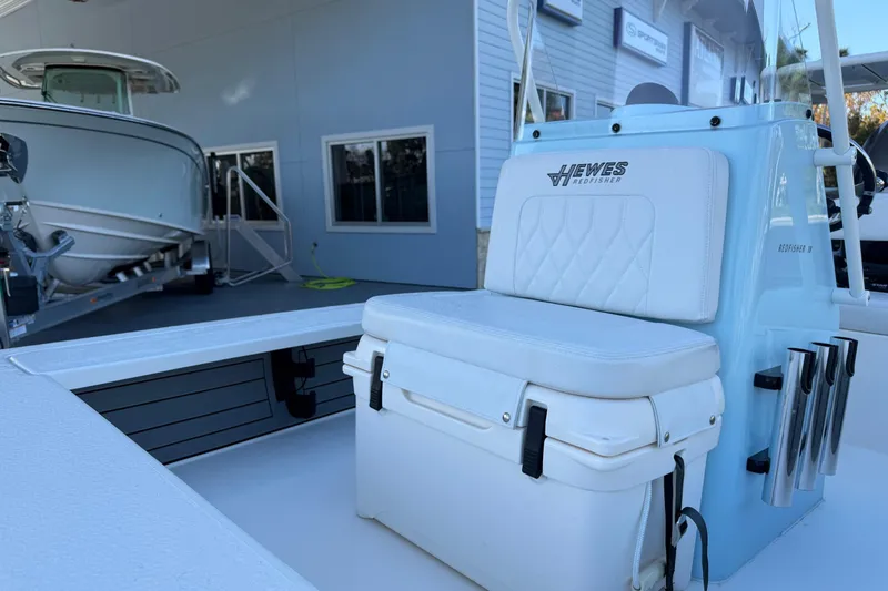 Slide: The Image of 2022 Hewes Redfisher 18 boat with white seat and rod holders. - 11