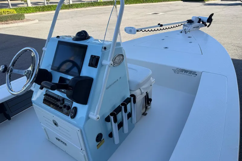 Slide: The Image of 2022 Hewes Redfisher 18 boat with steering console and rod holders. - 7