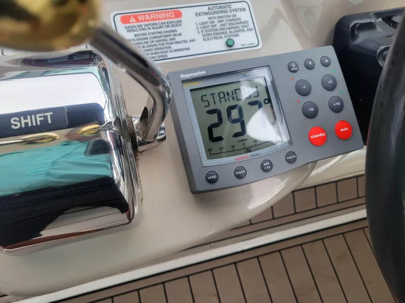Slide: The Image of Close-up of 2006 Sea Ray 320 Sundancer boat control panel with Raymarine display. - 11