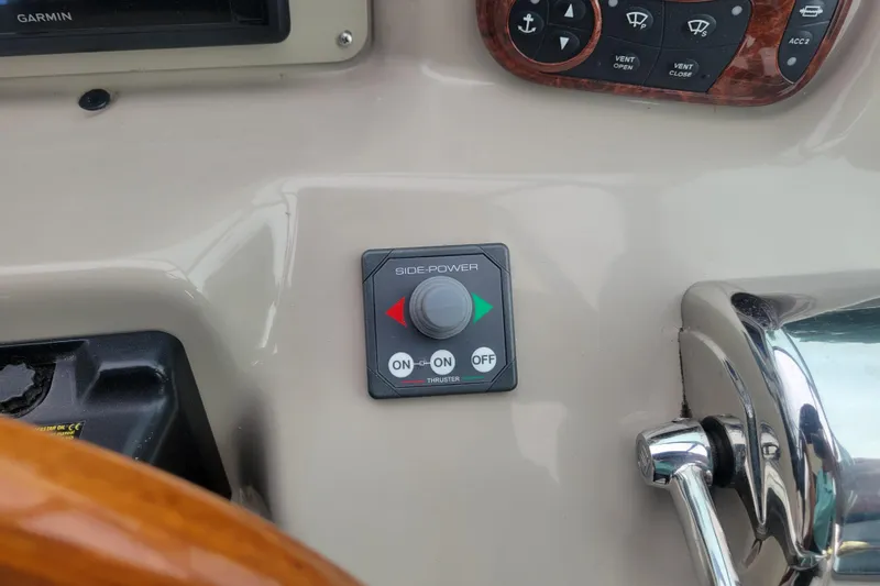 Slide: The Image of Control panel of a 2006 Sea Ray 320 Sundancer boat. - 13