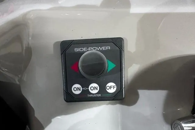 Slide: The Image of Control panel for Side-Power thruster on 2006 Sea Ray 320 Sundancer boat. - 33