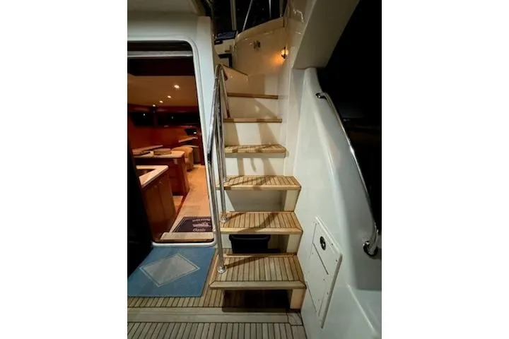 Slide: The Image of Staircase on 2009 Mikelson Zeus Sportfisher yacht leading to luxurious interior. - 33
